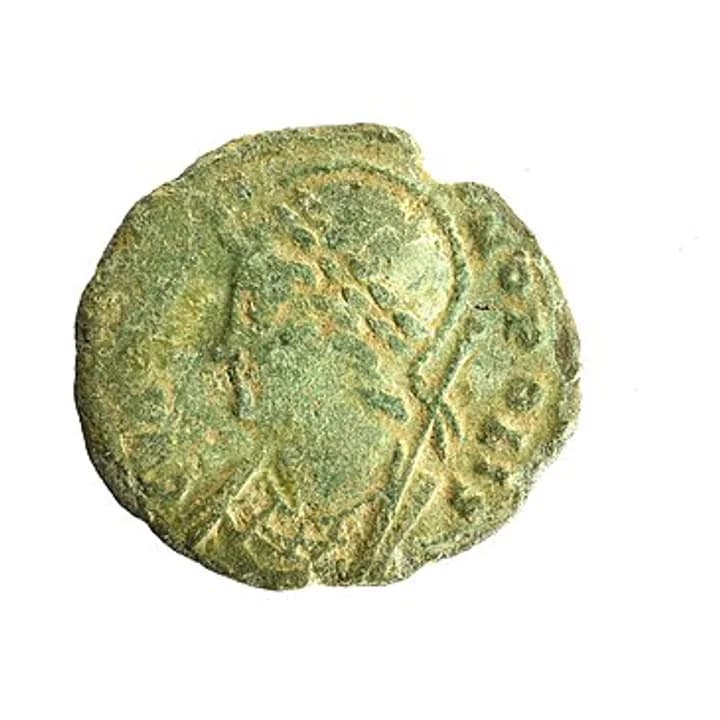 Worn Roman coin showing Constantinopolis wearing a crested helmet